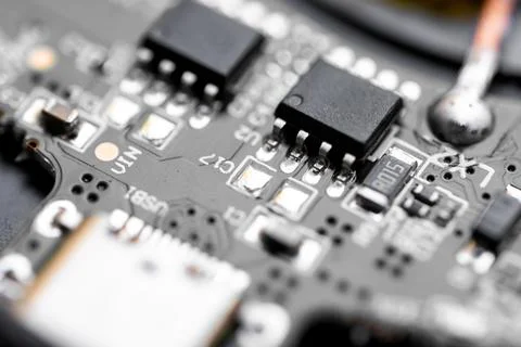 Electronic circuit board close-up. Chips on the board Stock Photos