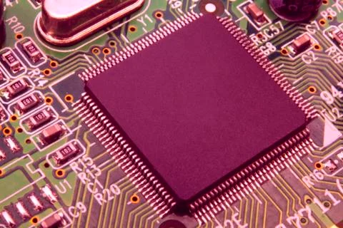 Electronic circuit board close up with different lighting. Stock Photos