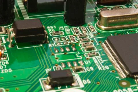 Electronic circuit board close up with different lighting. Stock Photos