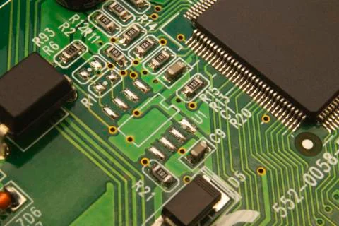 Electronic circuit board close up with different lighting. Stock Photos