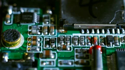 Electronic circuit board components close-up showing resistors and capacitors Stock Footage 310521254