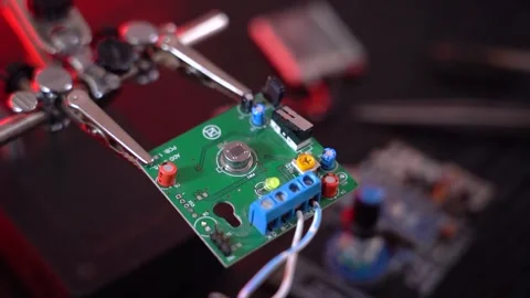 Electronic circuit board with components, on the engineer's desk Stock Footage 171870302
