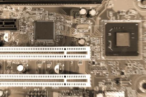 Electronic circuit boards on brown background with chip slot , selective focu Stock Photos