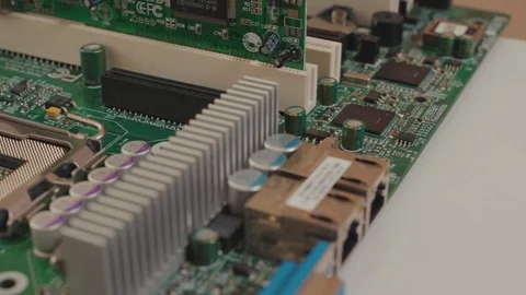 Electronic circuit chip in macro mode. Close-up computer motherboard with Stock Footage 123321496