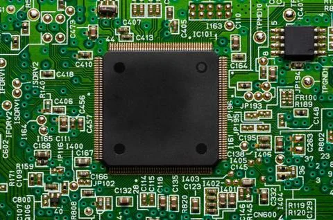 Electronic circuit close-up microchip on a green microcircuit with elements of Stock Photos