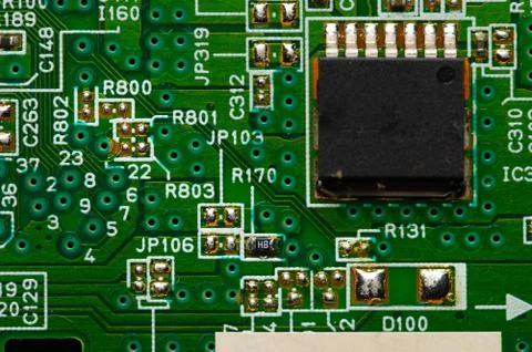 Electronic circuit close-up microchip on a green microcircuit with elements of Stock Photos