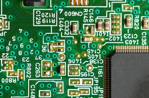 Electronic circuit close-up microchip on a green microcircuit with elements of Stock Photos