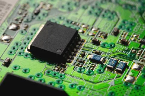 Electronic circuit close-up microchip on a green microcircuit with elements of Stock Photos