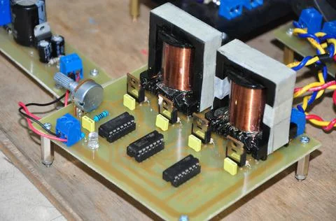 An electronic circuit of a voltage and current amplifier Stock Photos