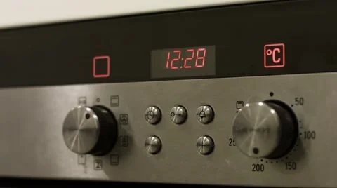 Electronic clock work on the oven in the kitchen Stock Footage 45884495