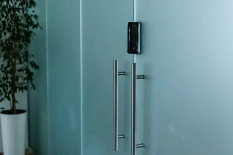 Electronic Code Entry. glass door, hand, intercom Fotos de archivo