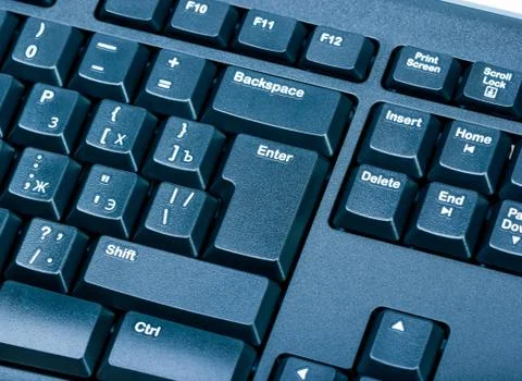 Electronic collection - close-up black computer keyboard with russian letter. Stock Photos