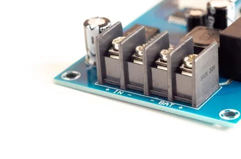 Electronic components, chips and capacitors on the blue pcb, close up view... Stock Photos