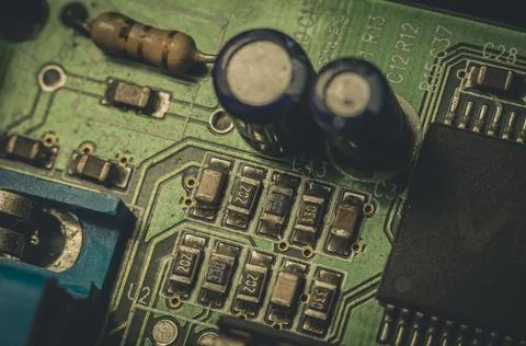 Electronic components close-up on an old computer motherboard. Dust on the Foto stock