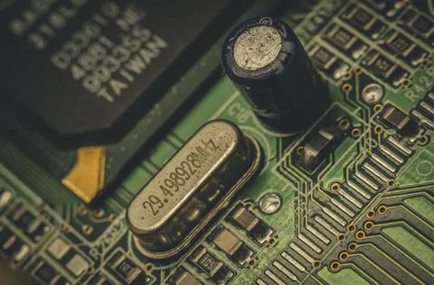 Electronic components close-up on an old computer motherboard. Dust on the Stock Photos