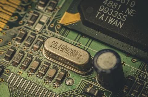 Electronic components close-up on an old computer motherboard. Dust on the Stock Photos