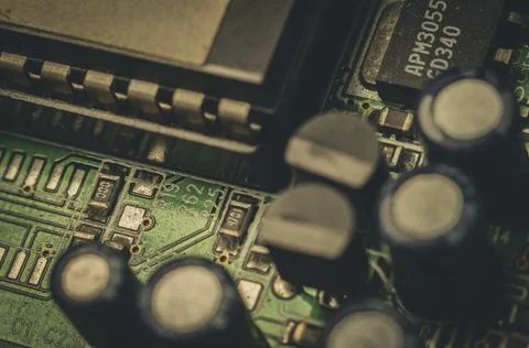 Electronic components close-up on an old computer motherboard. Dust on the Stock Photos