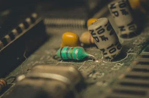Electronic components close-up on an old computer motherboard. Dust on the Stock Photos