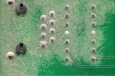 Electronic components close-up on an old computer motherboard. Dust on the Foto stock
