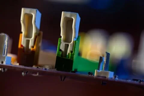 Electronic components mounted on a green substrate part of modern digital inf Stock Photos