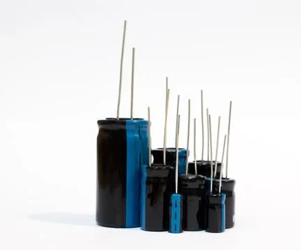 Electronic components - a set of electrolytic capacitors on white background Stock Photos
