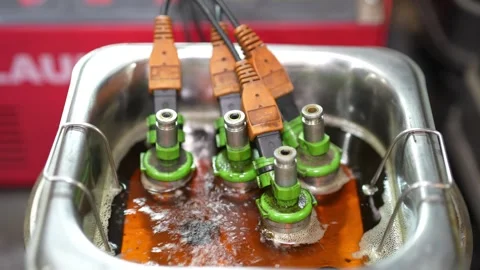 Electronic components submerged in cleaning solution with connectors Stock Footage 347303520