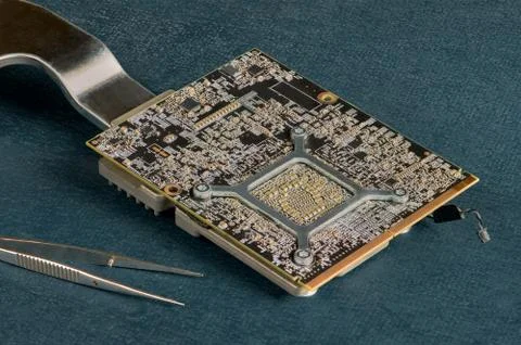Electronic computer hardware technology. Circuit board on blue background clo Stock Photos
