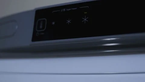 Electronic control on a touch panel of a freezer. Alert indicator blinking Stock Footage 145699951