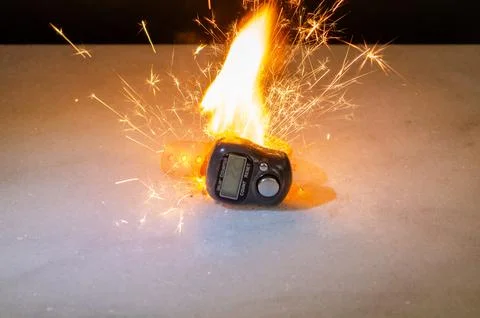 Electronic counter on surface with sparks as device danger concept 스톡 사진
