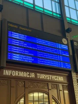 Electronic departure board displaying train schedules at a historic railway Stock Photos
