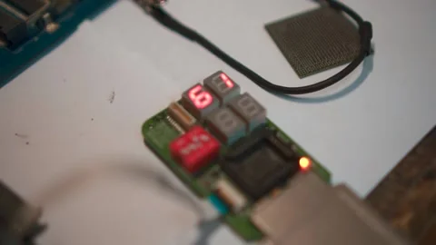 An electronic device with numbers takes a measurement Stock Footage 142375409