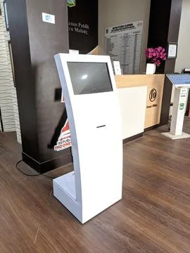 Electronic digital white queue machine with defocused background Stock Photos