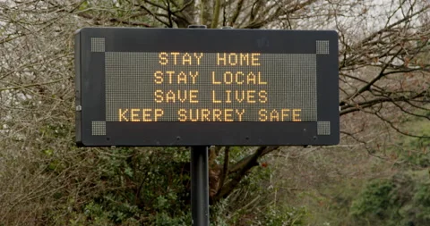 Electronic display close-up asking people to stay home Stock Footage 146465070