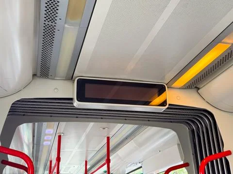 Electronic display panel inside tram with lights and metal structure around p 스톡 사진