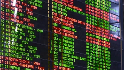 On the electronic display of the railway station, the timetable Stock Footage 86653981