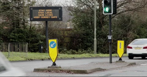 Electronic display by road side asking people to stay home Stock Footage 146466003