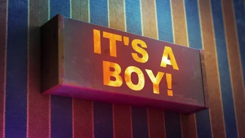 Electronic display showing red light message IT'S A BOY Stock Footage 265069638