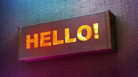 Electronic display showing red light message Hello! Stock Footage 268597979