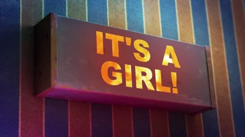 Electronic display showing red light message IT'S A GIRL! Stock Footage 268598013