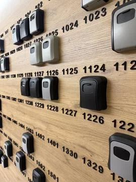 Electronic door locks displayed on wall in showroom for security solutions .. Stock Photos
