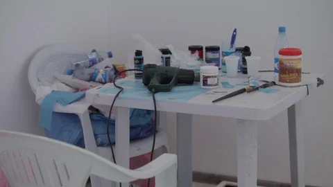 Electronic drill, brush and paint on the table Stock Footage 86457507