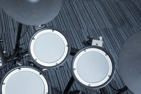Electronic drum set in the room corner as musical background technology theme Foto stock