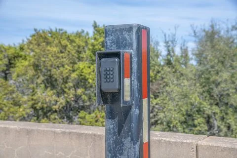 Electronic gate lock with key code at the Lake Austin Dam facility in Texas 스톡 사진