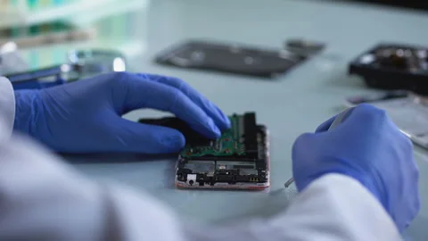 Electronic hands assembling mobile phone, connecting device parts, development Stock Footage 88204958