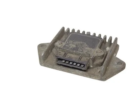 Electronic ignition control module with pin blade terminal, dusty, isolated.. Stock Photos