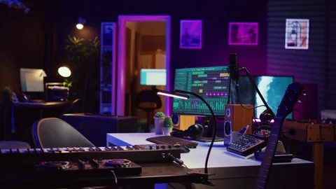 Electronic instruments used for mixing and recording tunes in empty home studio Stock Footage 268350472