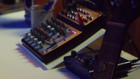 Electronic instruments used for mixing and recording tunes in empty home studio Stock Footage 268374044