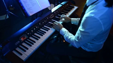 Electronic keyboard player at concert Stock Footage 82295420
