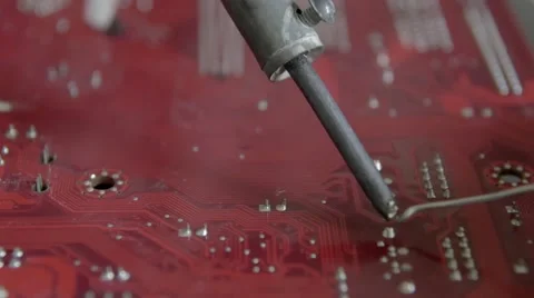 Electronic lab working place with soldering iron and circuit board Stock Footage 67740628