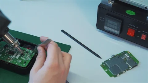 Electronic lab working place with soldering iron and circuit board. 스톡 동영상 105972388